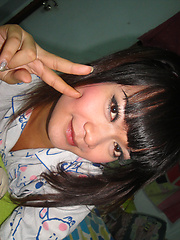 Teen Ladyboy Ping fucks herself with a big green cucumber