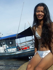 Young and hot Thai dickgirl proudly showing her hard meat on a Phuket's beach