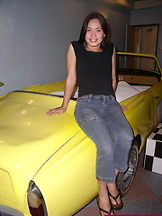 Slim ladyboy ready for the shag in the car-shaped bed of a love-hotel room