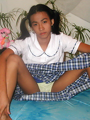Petite ladyboy stripping from her school uniform and spreading